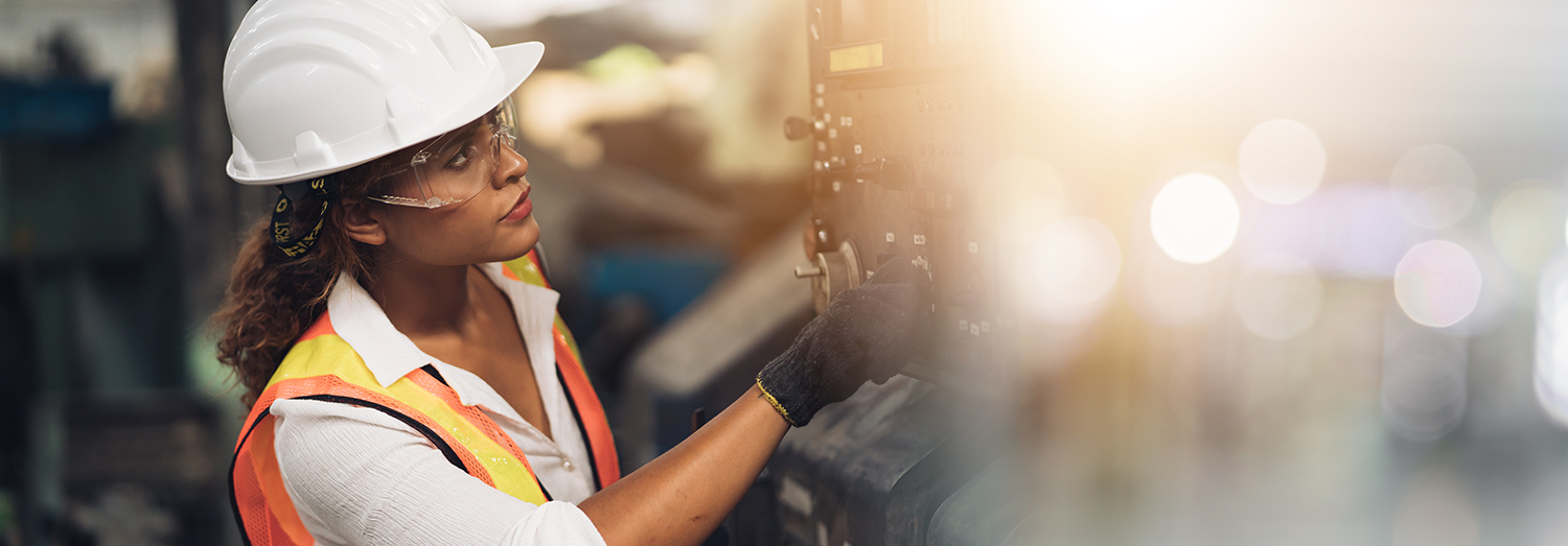 African American woman working in an industrial setting